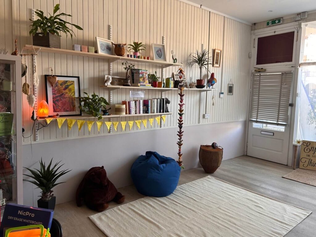 Cozy reading nook with plants and bean bag